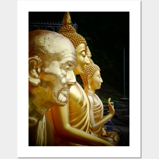 3 Buddhas seated, Thailand. One depicted as an old man. Wall Art by JonDelorme